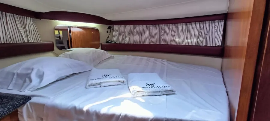 The stern cabin's double bed, made up with fresh towels